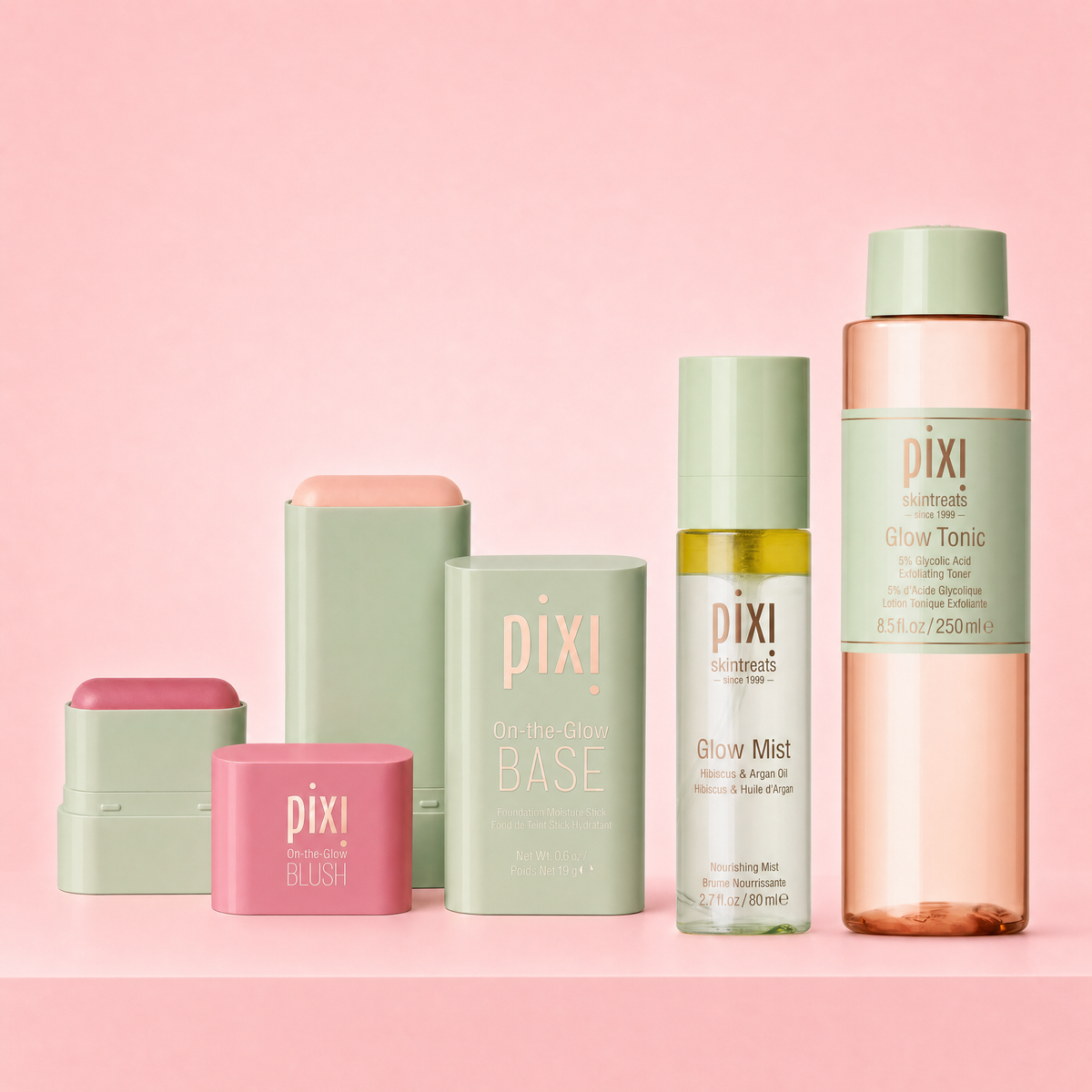 Bundle shown on a pink background featuring On-the-Glow BLUSH Petite, On-the-Glow BASE, Glow Mist, and Glow Tonic Original Size
